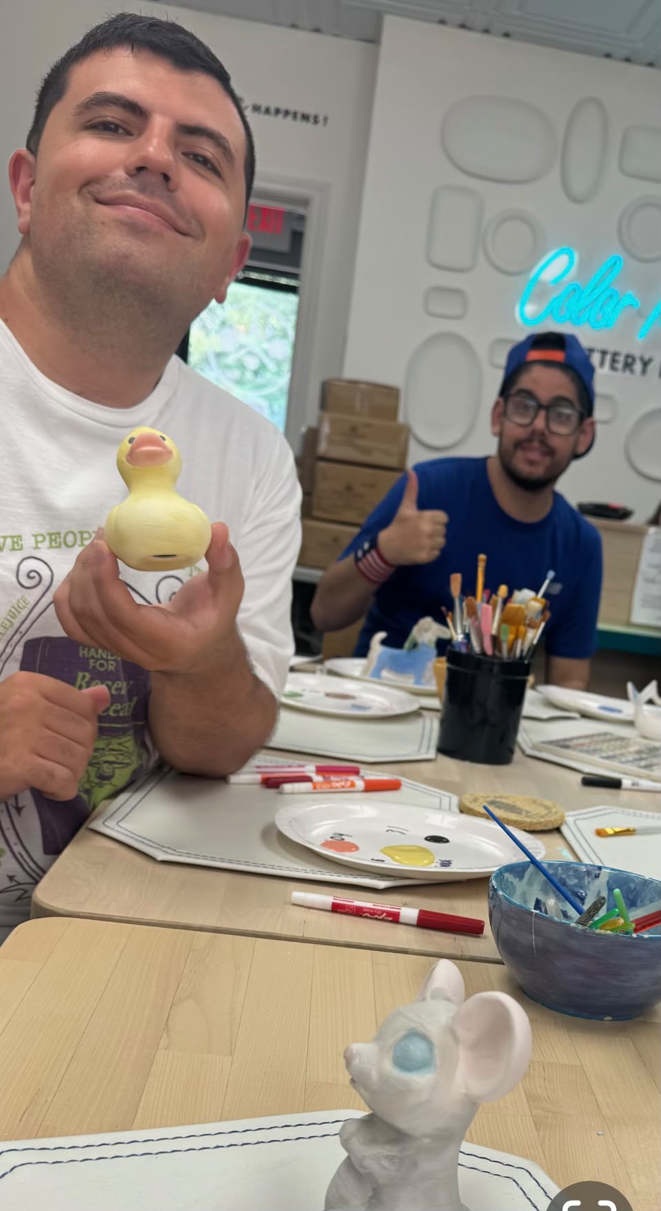 Participants enjoying a creative pottery activity together